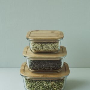 a stack of three glass containers filled with food